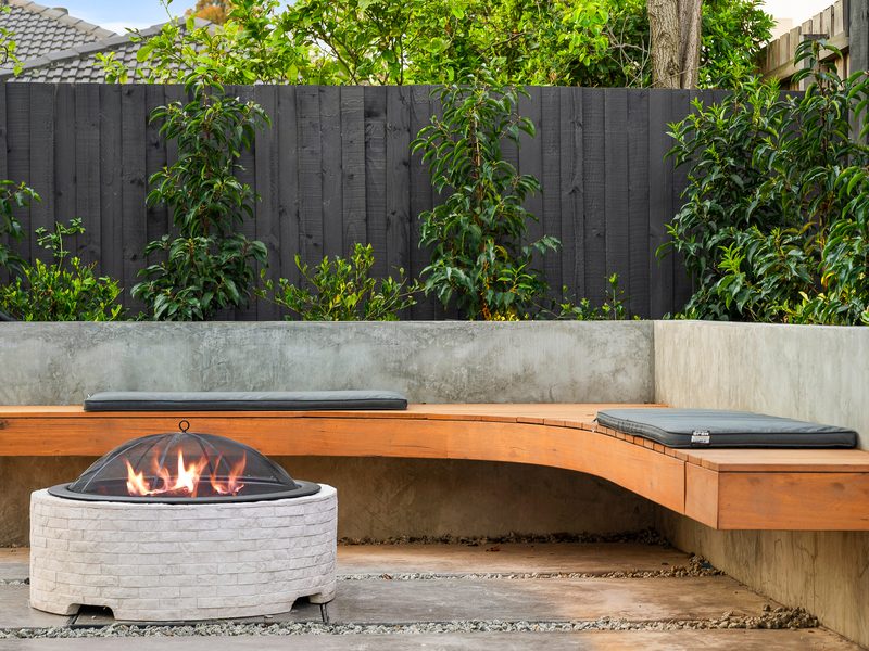 Fire pit lounge with timber seating, Brighton VIC | MEG Outdoor