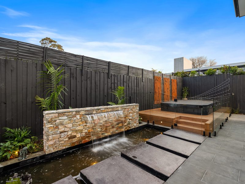Stone water feature with pond and paving, Brighton VIC | MEG Outdoor