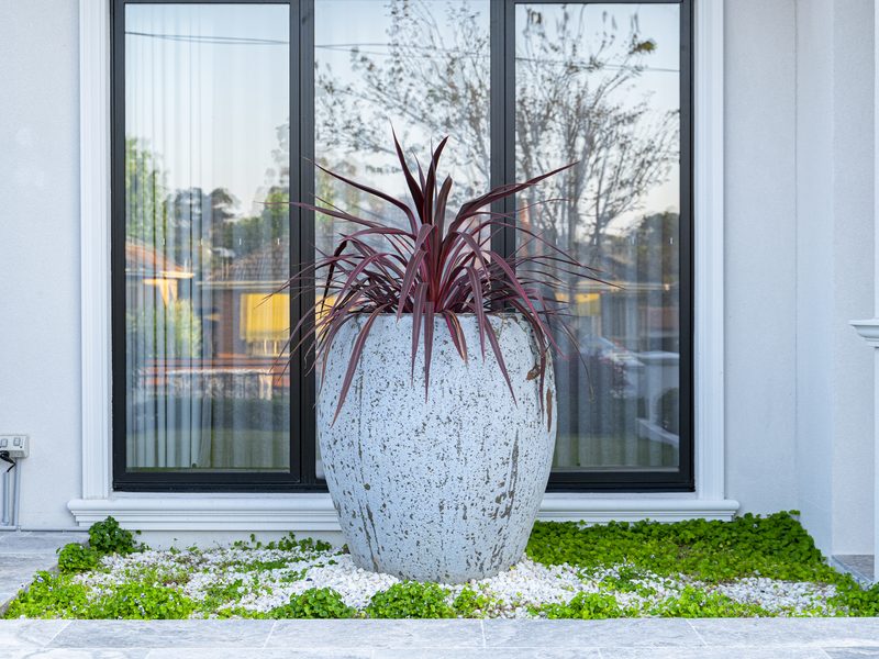 Weathering steel feature with stone paving, Burwood VIC | MEG Outdoor