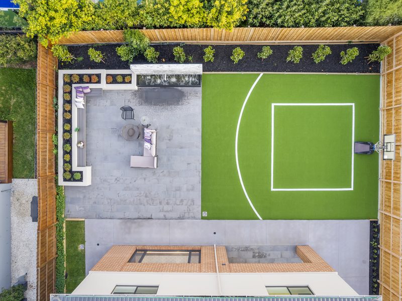 Sport court with outdoor lounge and timber screening, Camberwell VIC | MEG Outdoor